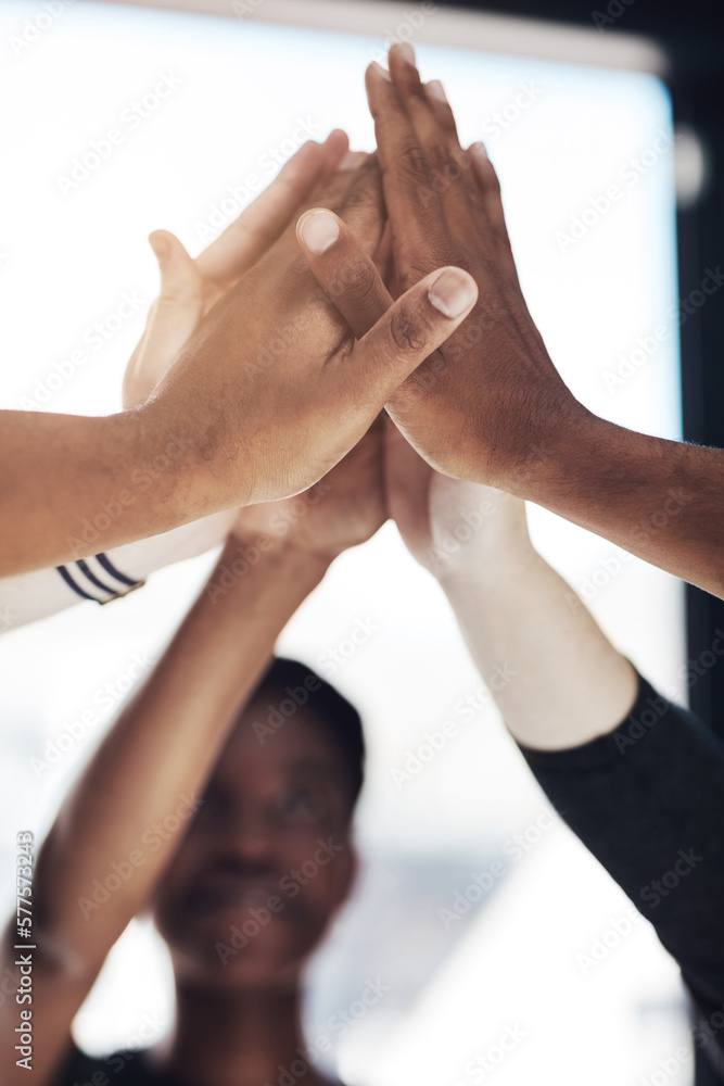 Aufkleber time to unify. cropped shot of a group of colleagues giving each other a high five at work.