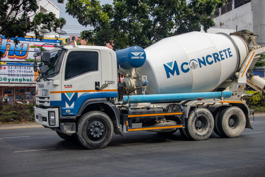 SAMUT PRAKAN, THAILAND, FEB 04 2023,  A truck with a concrete mixer is driving on a city street