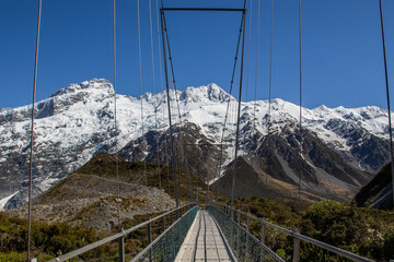 cable bridge and mountains