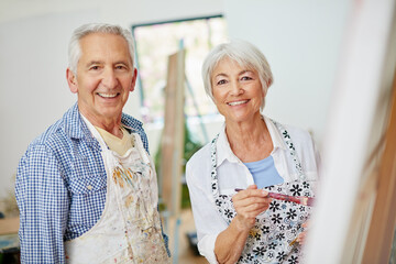 Do more of what makes you happy. Shot of a senior couple painting at home.