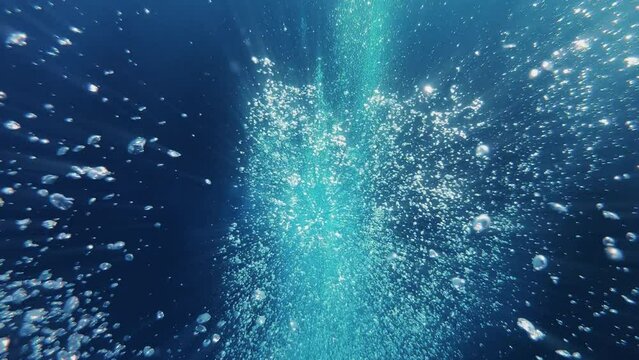 Air bubbles and sun rays under water, 4k