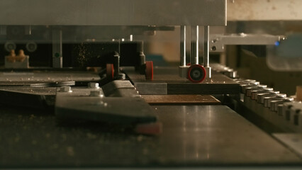 Close-up of automated machine for wooden boards. Creative. Modern automated machine for wooden...