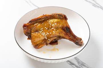 angle view roasted chicken drumstick at horizontal composition