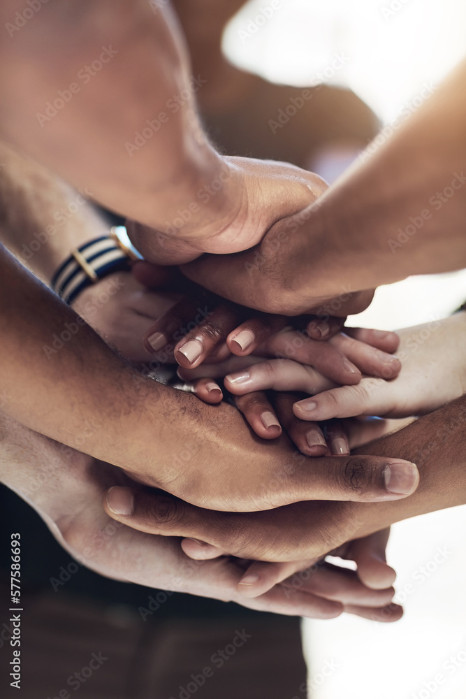 Poster were all connected. cropped shot of a work group joining hands in solidarity.