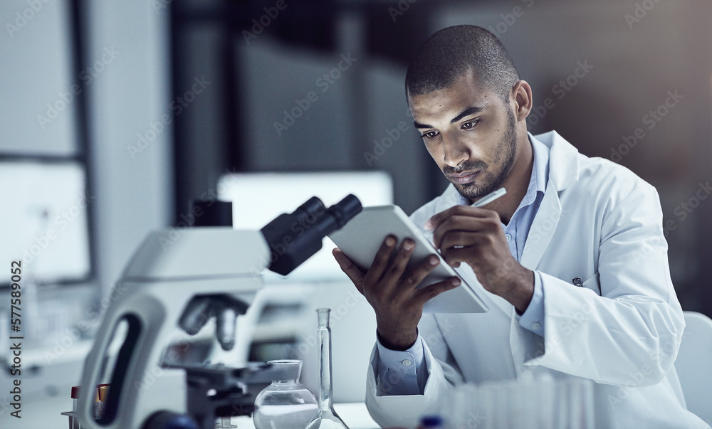 Poster announcing his findings to the world. shot of a scientist recording his findings on a digital tablet