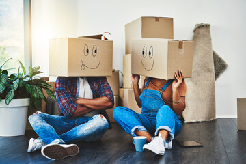 All happy they in their new place. Shot of an unrecognizable couple moving house.