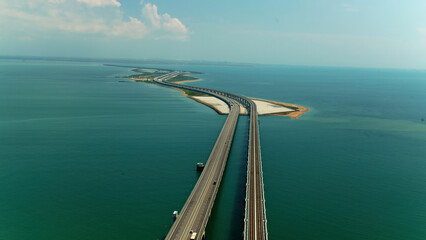 Bird's eye view. Shot.A huge bridge made of white material stretching from kilometers to move over...