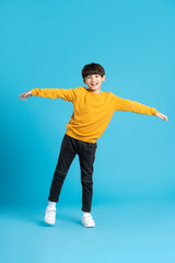 full body image of asian boy posing on blue background