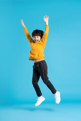 full body image of asian boy posing on blue background