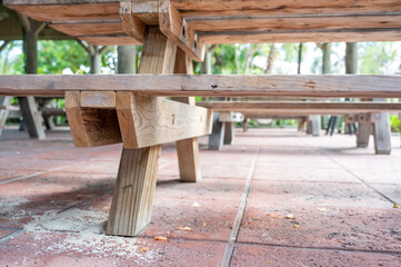 Fototapeta premium Spilled drink on a wooden picnic bench.