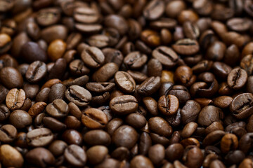 Roasted coffee beans close up background with central line focus