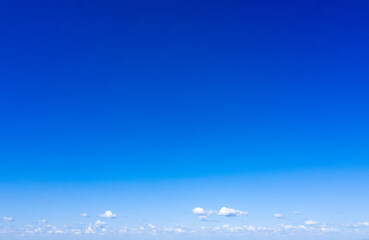 Naklejka na ściany i meble blue sky background with tiny clouds