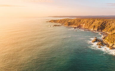 Aerial seascape of Australian coastline with sunrise sky - 577606607