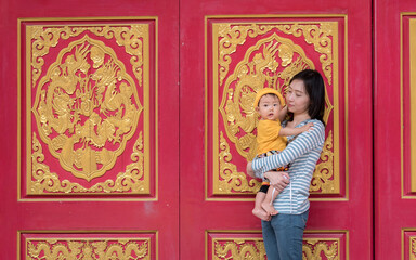 Chinese mother and son at temple