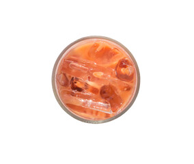 Top view of orange iced condensed Thai milk tea in transparent glass isolated on white background with clipping path in png file format