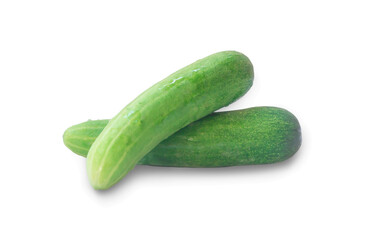 Two fresh green cucumbers vegetable in stack, heap or pile isolated on white background with clipping path and shadow in png file format