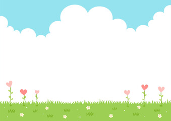 Heart flower plants on grass and sky background.