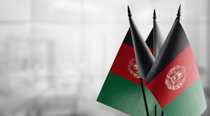 A small Afghanistan flag on an abstract blurry background