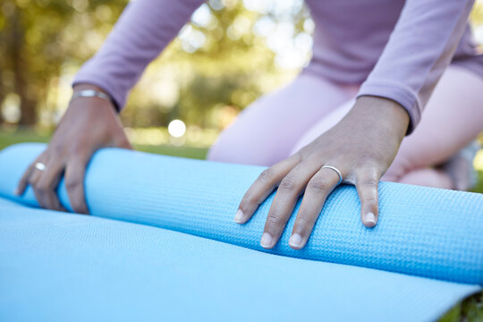 Yoga mat, woman hands and exercise outdoor ready to start fitness with blurred background. Zen exercise, meditation and pilates workout of a female in nature for wellness and stretching with peace