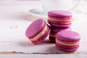 Three pink macaroons on a light background