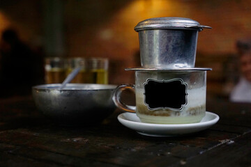 Vietnamese specialty dripping salted coffee cup with label stick                              