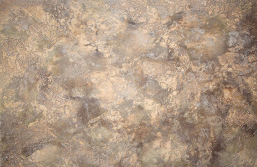 Brown background from decorative plaster with abstract spots. Unusual beige wall texture with beautiful patterns, creative surface background. Front covering for facing of buildings.