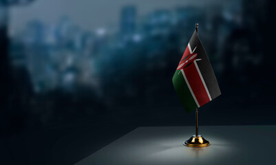 Small flags of the Kenya on an abstract blurry background