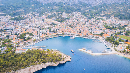 Fototapeta na wymiar Take in the breathtaking view of Croatia's ports and marinas from above, showcasing luxurious yachts in a stunning drone photo.