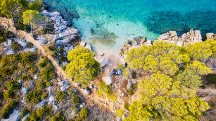 Naklejka na ściany i meble Take in the breathtaking aerial view of Makarska Riviera in Croatia, revealing a picturesque rocky beach and the vibrant turquoise water.