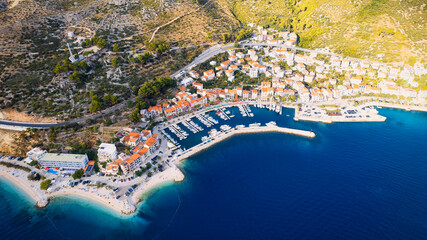 Take in the breathtaking view of Croatia's ports and marinas from above, showcasing luxurious...