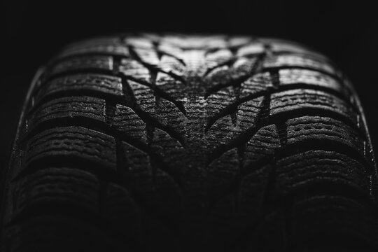 cool photo of a tire tread of a car wheel on a black background