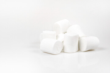 Fototapeta na wymiar White marshmallows on a white background.