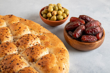 Ramadan pita, dates fruit and green olives.Islamic iftar table 
