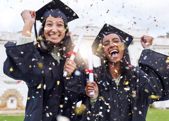 Queue the celebrations. Cropped portrait of two attractive young female students celebrating on...