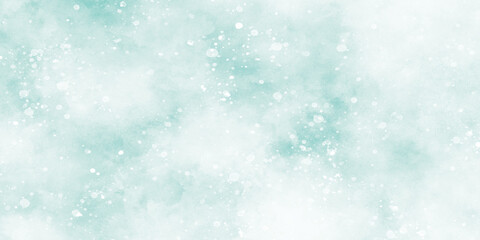 Abstract blurry and cloudy blue background with snowflakes, glogy and sparkle defocused background With blinking glitters,  light blue bokeh background for design.	