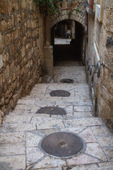 Jerusalem Old City streets: sewer manholes and arches