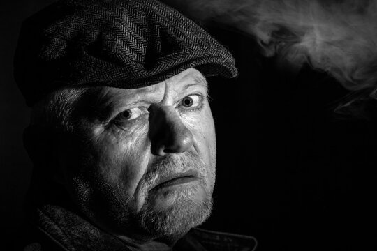 Portrait of an older man looking intense and attentive