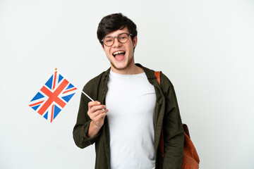 Young Russian man holding an United Kingdom flag isolated on white background with surprise facial expression - obrazy, fototapety, plakaty
