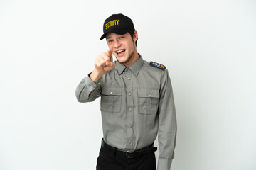 Young Russian security man isolated on white background surprised and pointing front