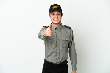 Young Russian security man isolated on white background shaking hands for closing a good deal