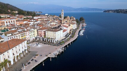 Europe, Italy, Brescia , Garda lake , Salo' drone aerial view of  village with church and lake with...