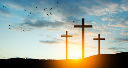 Christian crosses on hill outdoors at sunrise. Resurrection of Jesus. Concept photo.