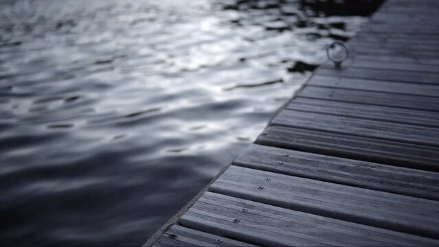 Jetty at sunset with the movement of waves and fish. Recorded in Cadaqu&eacute;s, Spain.