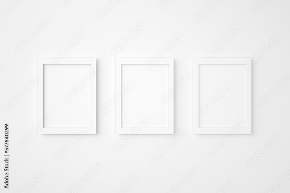 Poster three blank or empty rectangle picture frames hanging on white wall. mockup background image. 3d ren