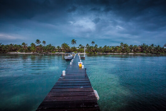 Tropical lodge dock at El Pescador Lodge, Ambergris Caye, Belize