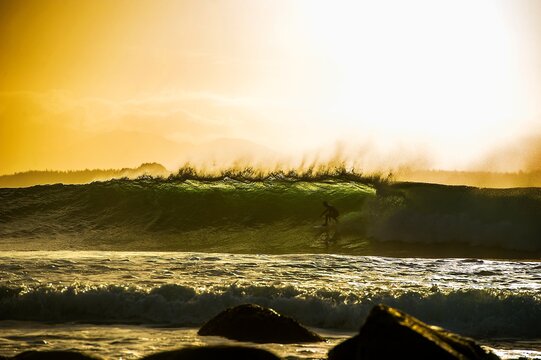 Surfer gets barreled early morning