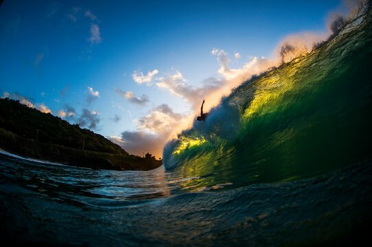 Surfer caught in the lip of a wave