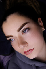 Pretty girl model after permanent eyebrow makeup procedure, eyebrow tattoo procedure after