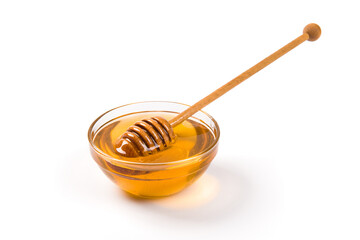 honey in glass bowl with honey dipper isolated on white background