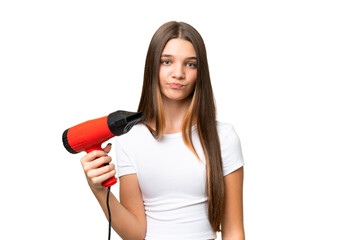 Teenager Caucasian girl holding a hairdryer over isolated background with sad expression